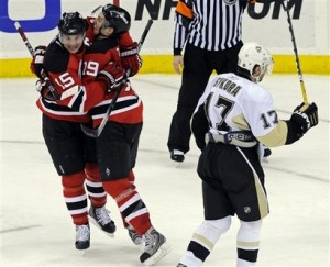 Jamie Langenbrunner (15) celebrates with Travis Zajac after scoring his third game-winning goal in three games.