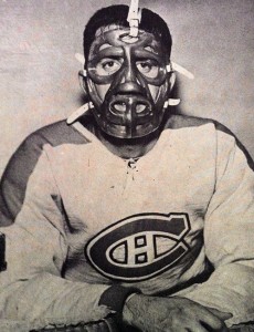 Cesare Maniago, displaying the mask former Ranger goalie Jacques Plante designed for him.